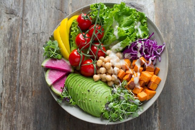Fresh salad bowl with avocado at Green Bowl